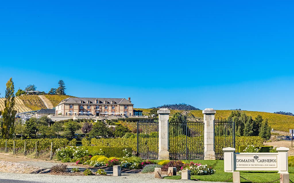 A large house with a sign that says Domaine Carneboc in front of it